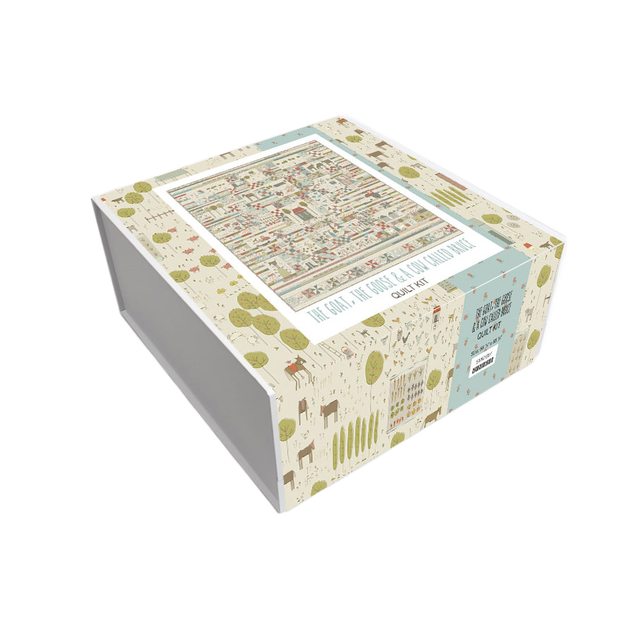 Boxed quilt kit package with multicolor farm print and clear window on lid