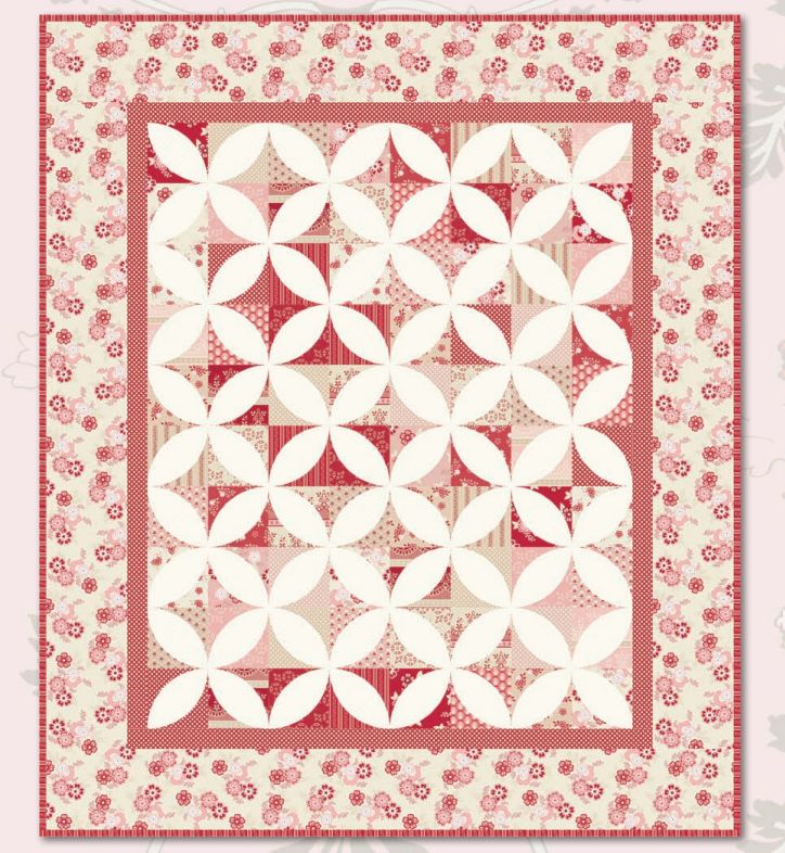Square quilt pattern layout with red floral border and cream geometric blocks