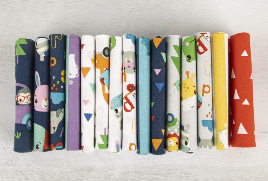 Row of colorful fabric swatches with various patterns on a light gray background