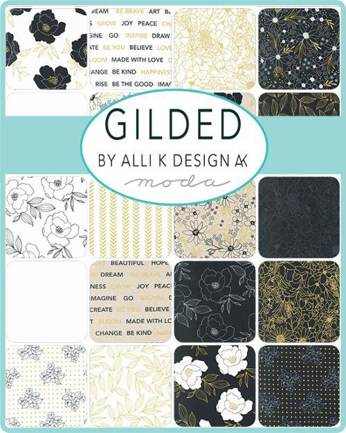 Quilt fabric charm pack layout, mixed black, white florals, gold accents, and text-like prints