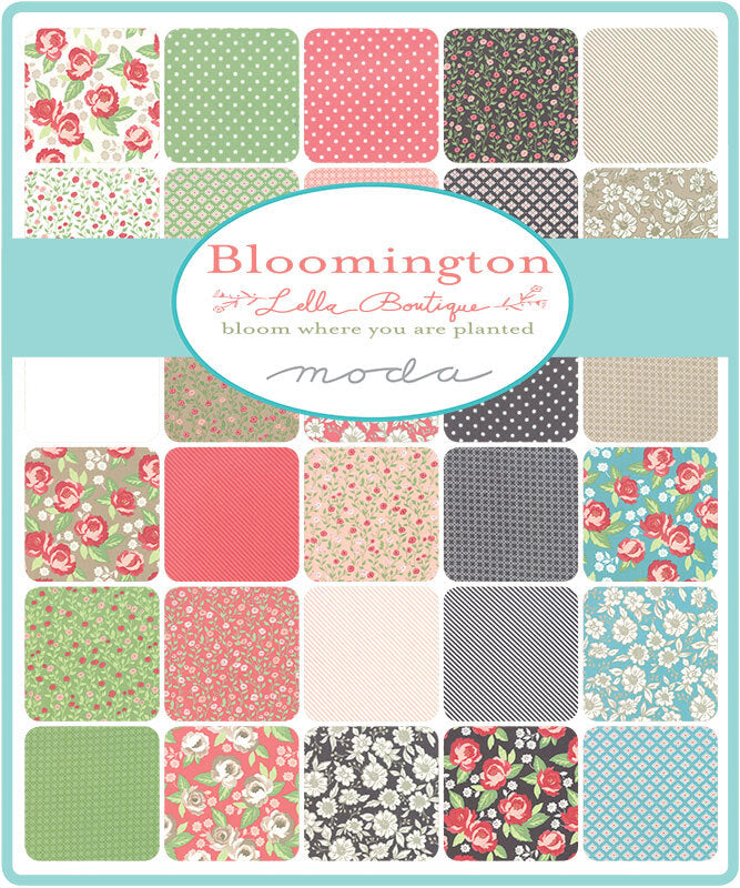 Charm pack of patterned fabric squares in red, green, blue, and neutral prints