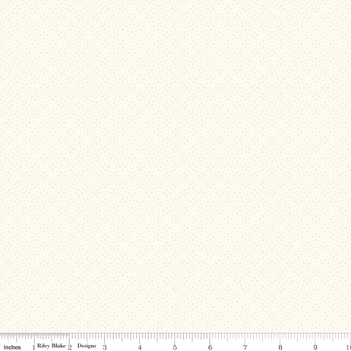 Fabric measurement scale with inch ruler on a cream background