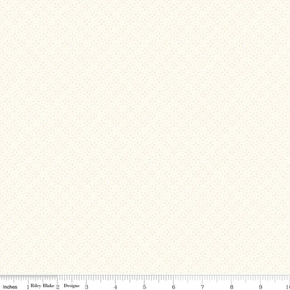 Cream daisy-print fabric swatch shown with an inch ruler for size