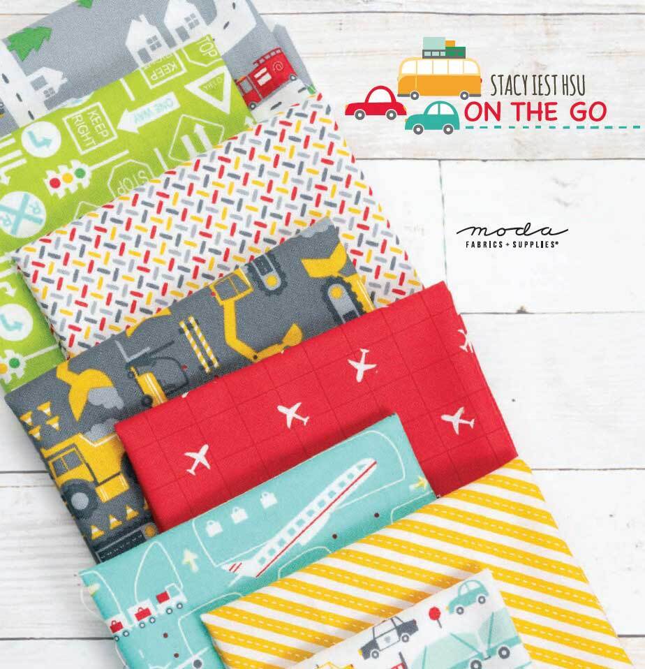 Moda On the Go fabric fat quarters stack with cars, trucks, and striped accents