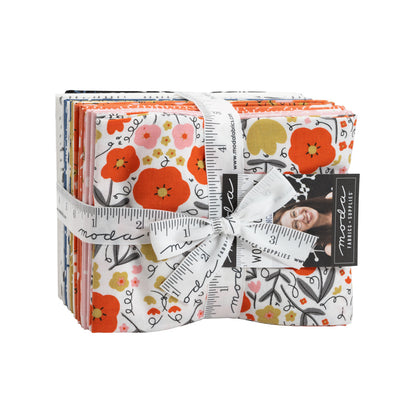 Quilt fabric fat quarter bundle with floral prints, orange and white, neatly tied with ribbon