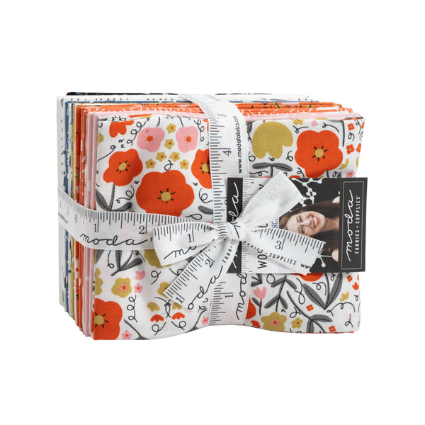Quilt fabric fat quarter bundle with floral prints, orange and white, neatly tied with ribbon
