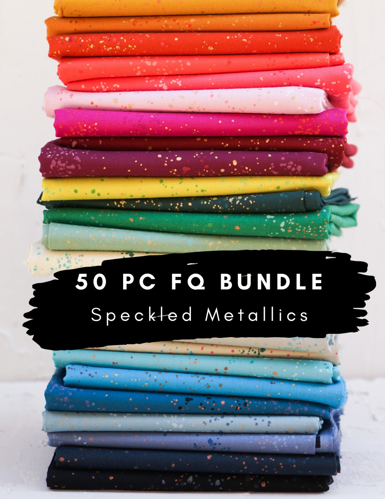 Speckled fat quarter bundle stacked in bright pink, orange, yellow, green, and blue