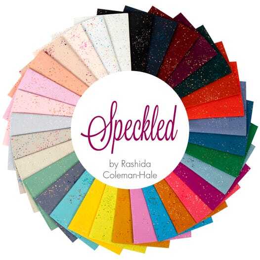 Speckled fat quarter fabric selection fanned in a circular rainbow of colors