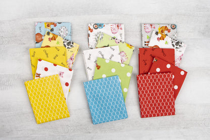Farm animal fat quarters laid out, yellow blue red and white prints