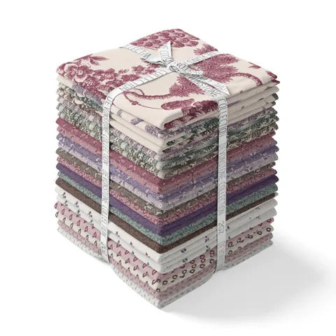 Multicolor fabric fat quarter bundle with folded quarters tied with ribbon