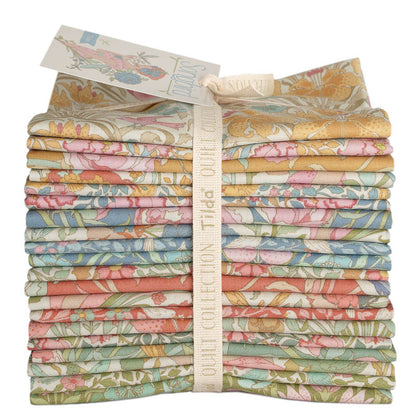 Quilt fabric fat quarter bundle with pastel bird and floral prints, neatly folded stack