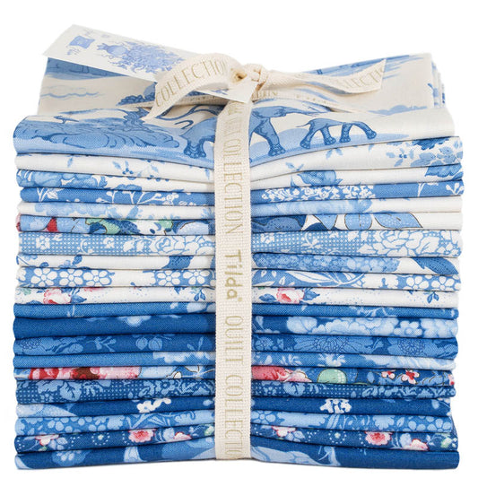 Stack of blue and white fabric bundles tied with a ribbon, Tilda Something Blue fat quarter bundle blue fabrics precut