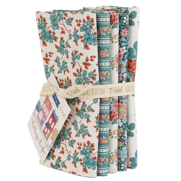 Set of five folded teal floral fat quarters with mixed orange, pink, and blue patterns