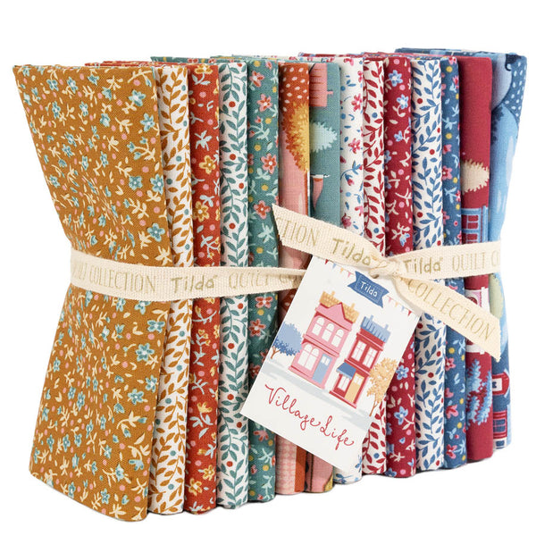 Folded fabric fat quarter bundle in orange, blue, red with floral and house patterns, Tilda label