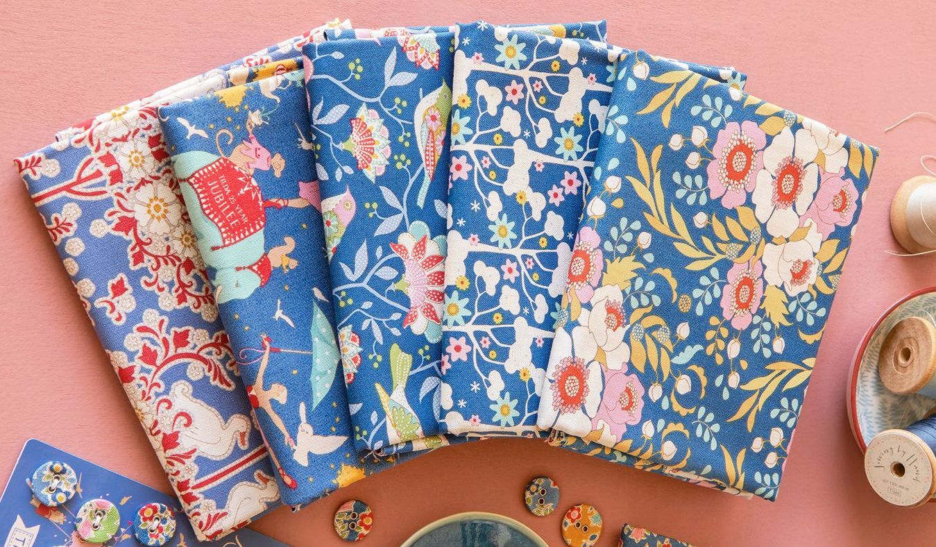Blue and multicolor floral fabric fat quarter bundle, folded quarters fanned