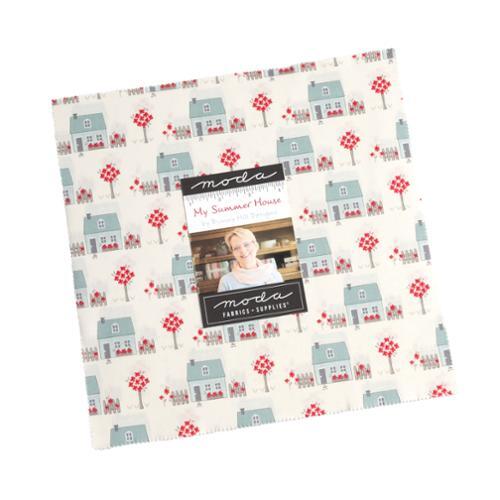 Cotton fabric layer cake, cream, blue, and red house and tree prints