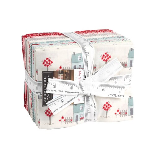Cotton fat quarter bundle with house and flower prints, red and teal, neatly folded