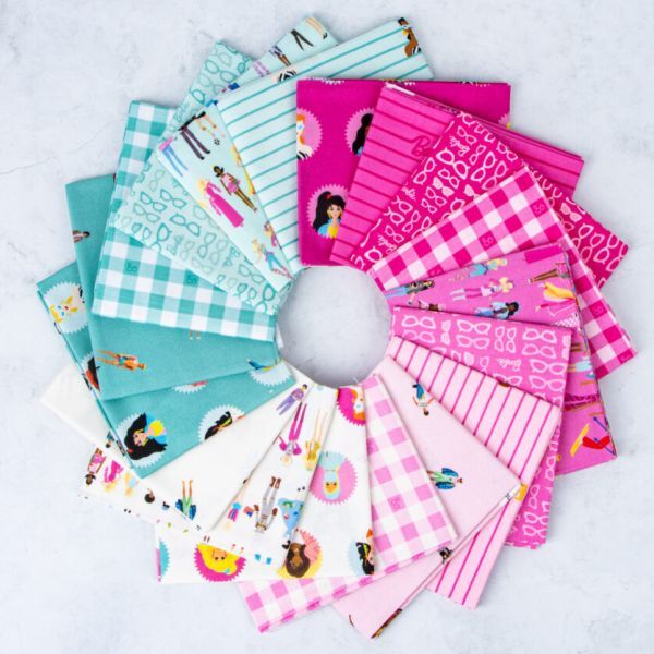 Mixed cotton fat quarter bundle with pink, teal, and white fabrics, gingham, stripes, and character motifs
