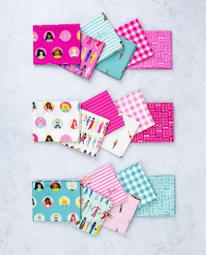 Folded cotton fat quarters with pink, teal, and white checks and stripes, assorted character prints