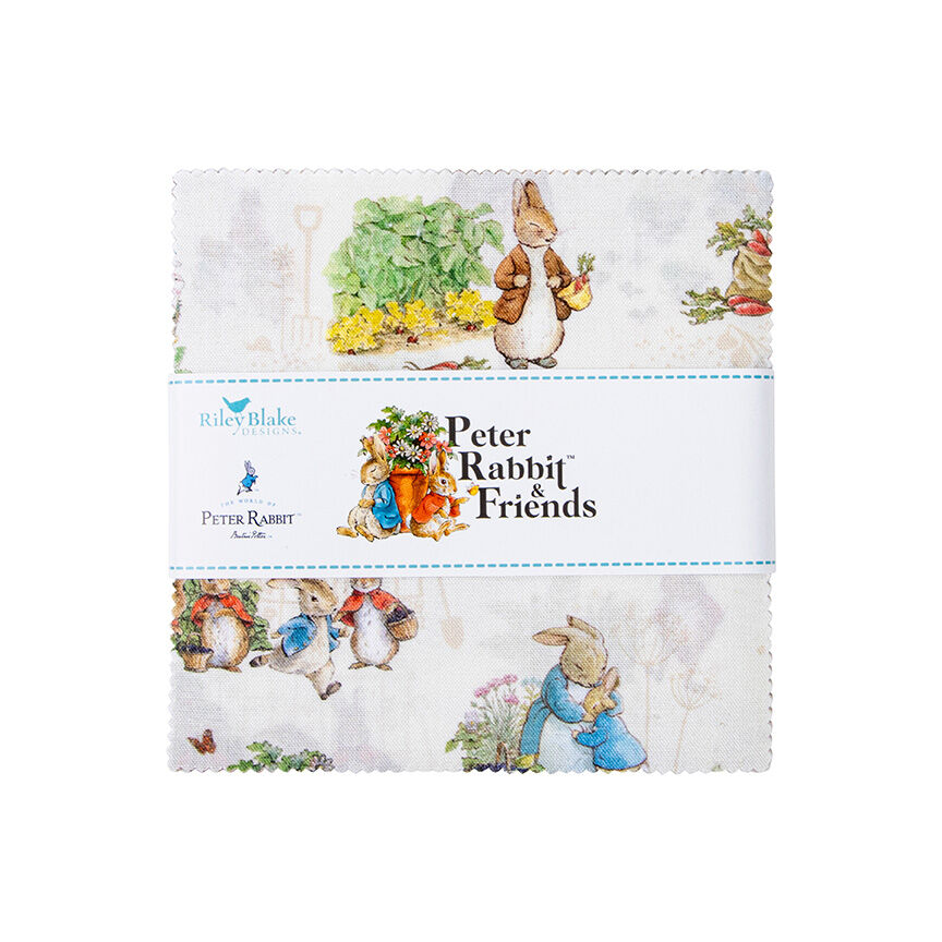 Peter Rabbit Friends fabric layer cake stack, light background with bunnies and plants