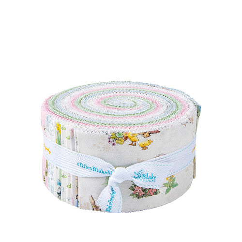 Quilt jelly roll fabric roll with pastel center spiral and woodland animal prints, ribbon tied