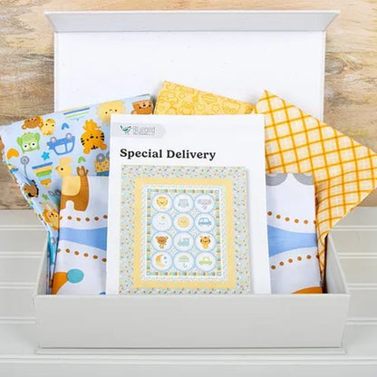 Baby animals quilt panel kit in open box, printed fabrics and yellow check backing