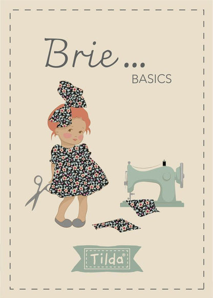Brie Basics charm pack label with doll, sewing machine illustration, and Tilda logo