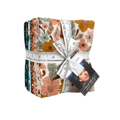 Floral and leaf quilt fat quarter bundle with folded fabric squares in warm tones