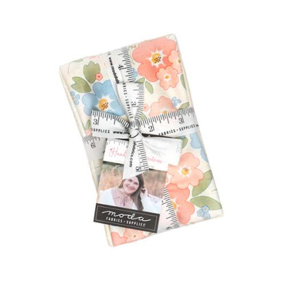 Fabric fat eighth bundle of pastel floral prints, folded rectangles tied with label