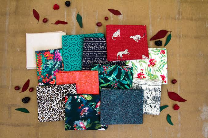 Fat quarter fabric bundle with assorted prints: florals, teal patterns, leopard, birds