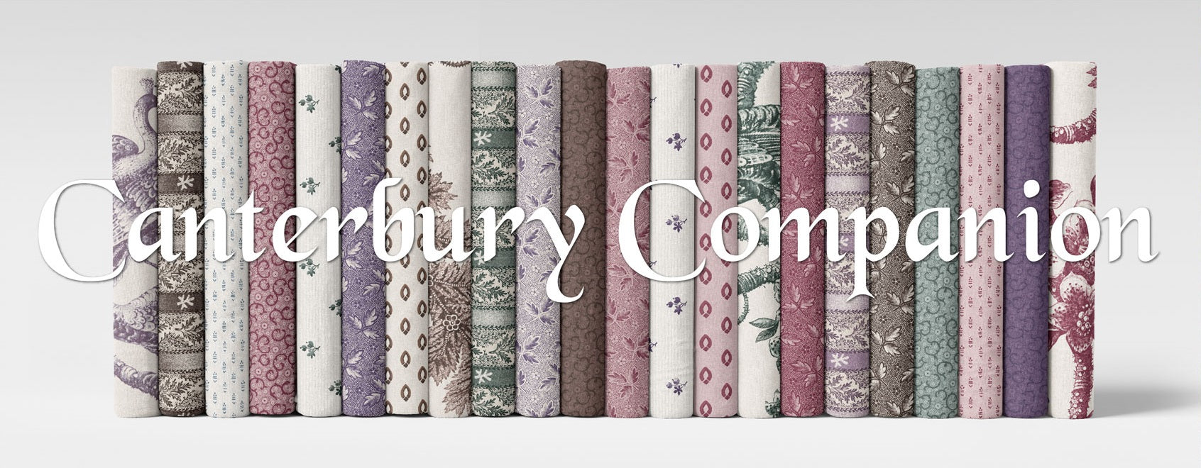 Assorted fabric fat quarter bundle with folded strips of geometric and floral prints