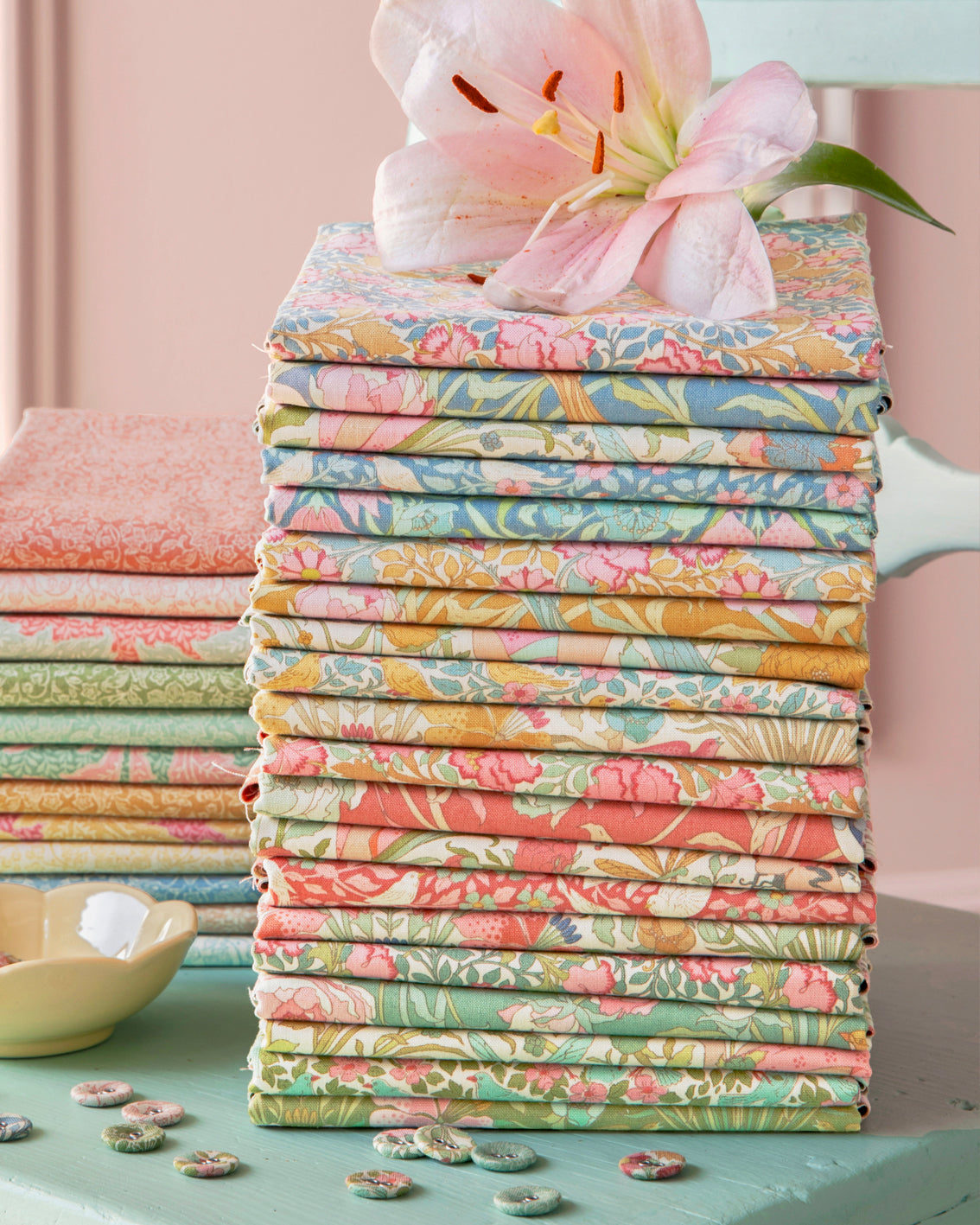 Quilt fabric fat quarter bundle stack with colorful bird, leaf, and flower prints