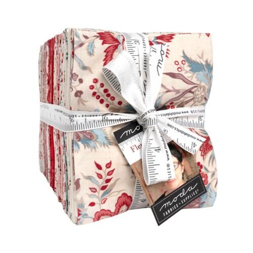 Floral fat quarter fabric bundle with red blue and cream prints, tied with ribbon