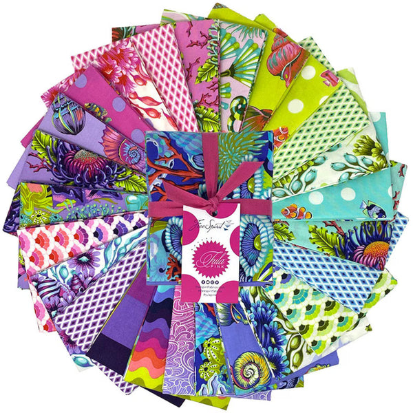 Collection of colorful fabric squares with a brand label Tula Pink Floral Reef