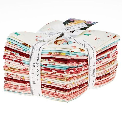 Stack of cowboy-themed cotton fat quarters with stars, hats, and red stripes