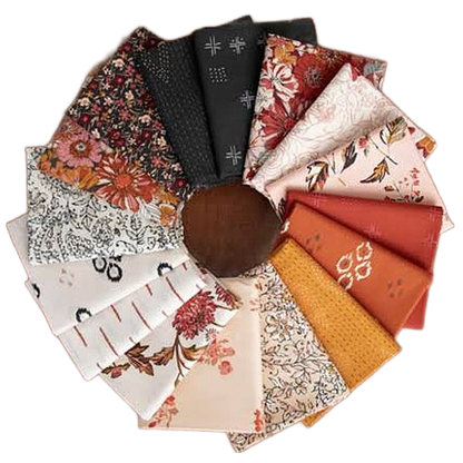 Round set of folded fat quarters with floral, paisley, and geometric motifs in assorted colors
