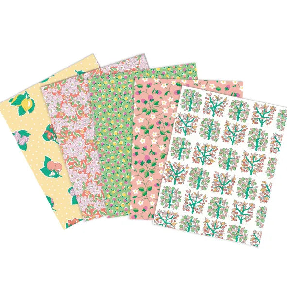Five square fabrics fanned out on a white background, each with a different floral and botanical print in pastel tones including yellow, pink, green, and white.