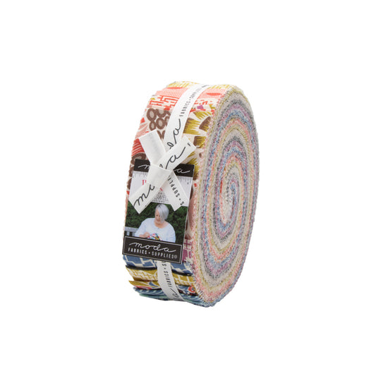 Multicolor fabric bundle roll with layered patterned strips and cream label