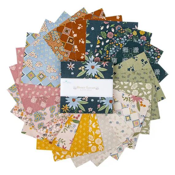 Collection of colorful fabric squares with a brand label in the center.