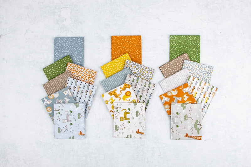 Assorted Leo and Savannah fabric strips showing lions, elephants, giraffes and coordinating nature designs