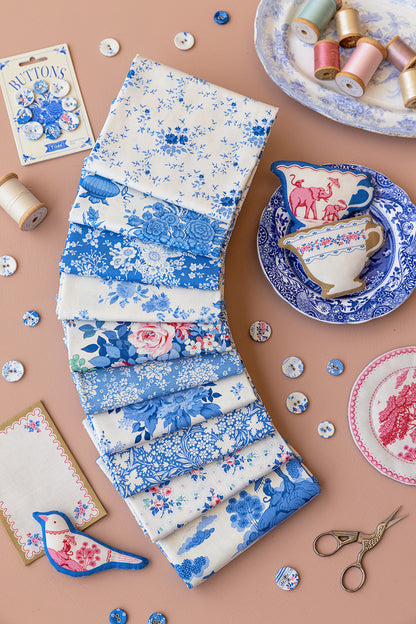 Fat quarter fabric bundle stack with blue floral and bird prints on white