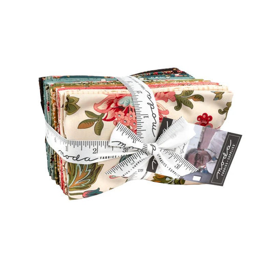 Pack of floral fabric squares with a measuring tape and Moda label on a white background