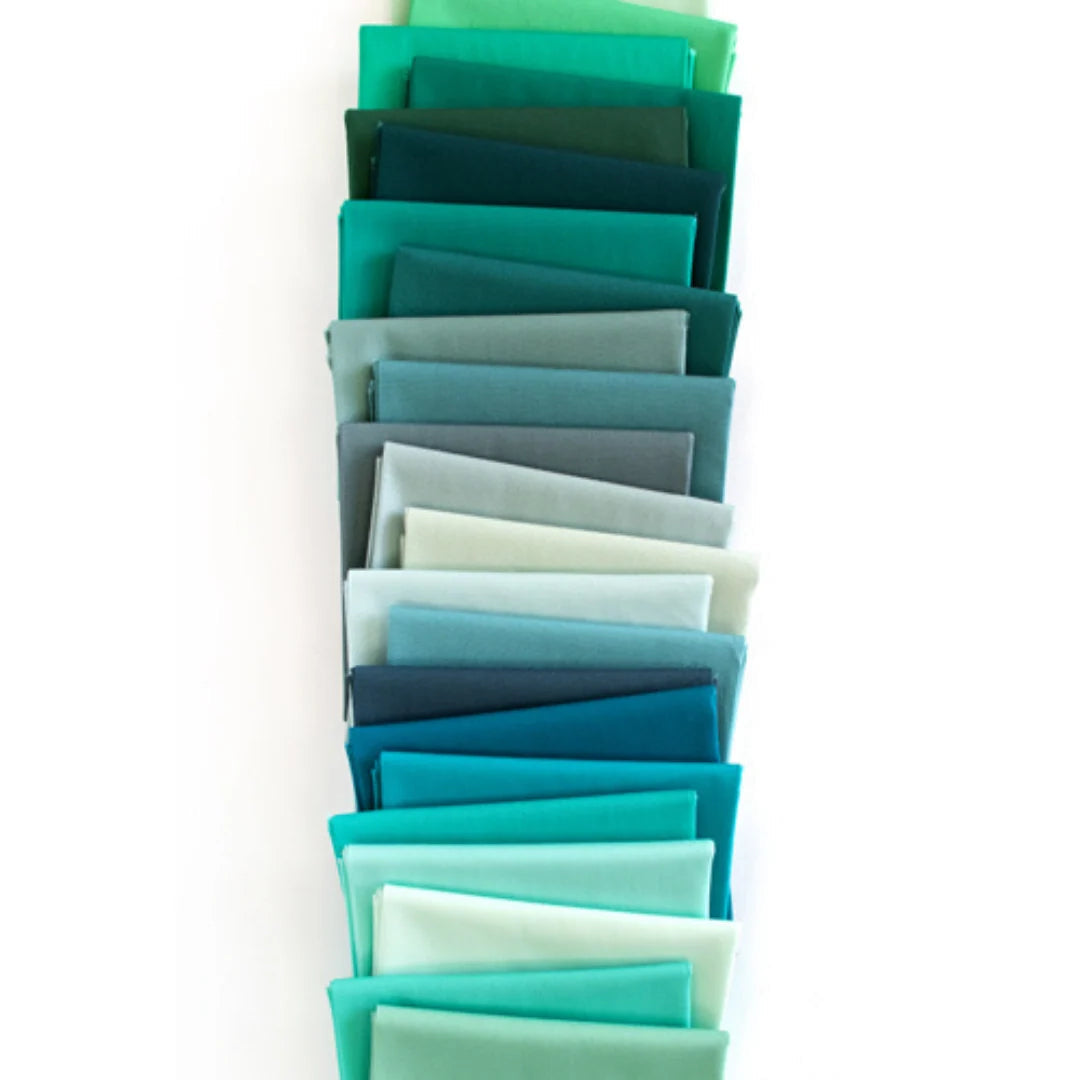 22 fat quarters solid teal and green fabric bundle, neatly folded