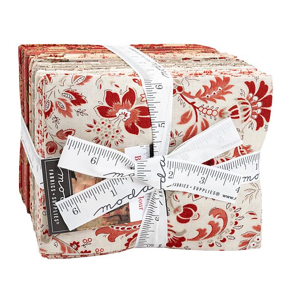 Fat quarter fabric bundle, red and cream floral prints, neatly folded squares