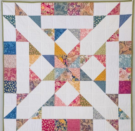 Quilt block PDF pattern featuring colorful patchwork triangles on a white background