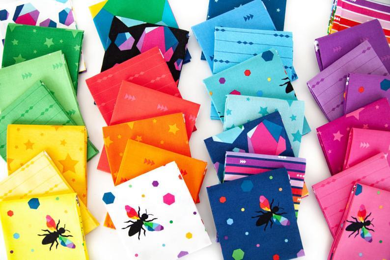 Collection of colorful fabric samples with various patterns and designs.