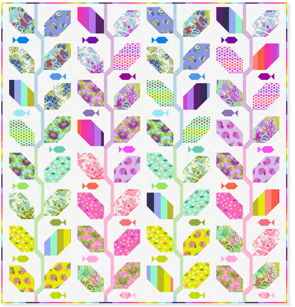 Colorful quilt vy Tula Pink with geometric , ocean and floral patterns on a white background