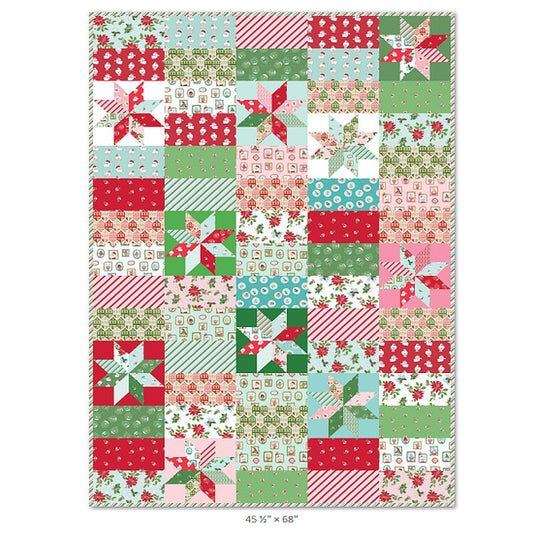 Christmas patchwork quilt top with red, green, and white printed fabric squares