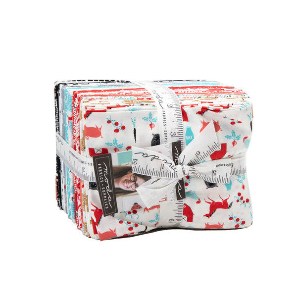 Stack of fabric bundles tied with a ribbon on a white background