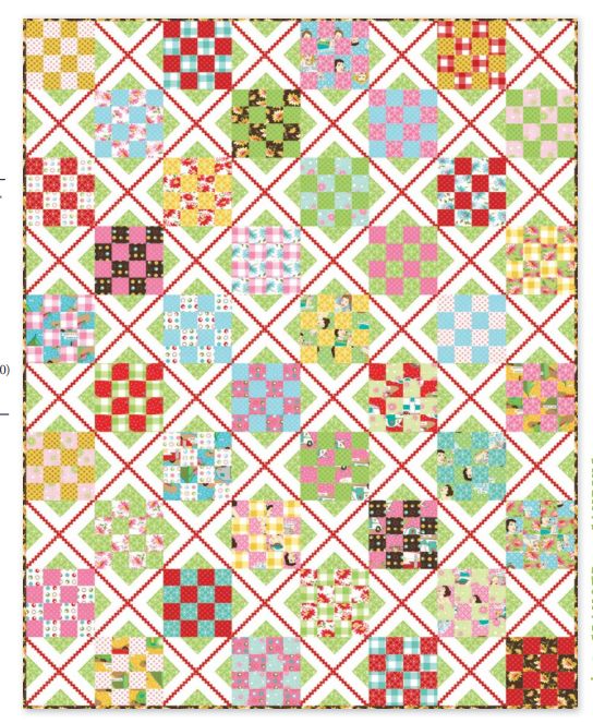Patchwork quilt with multicolor diamond and square blocks on white backing